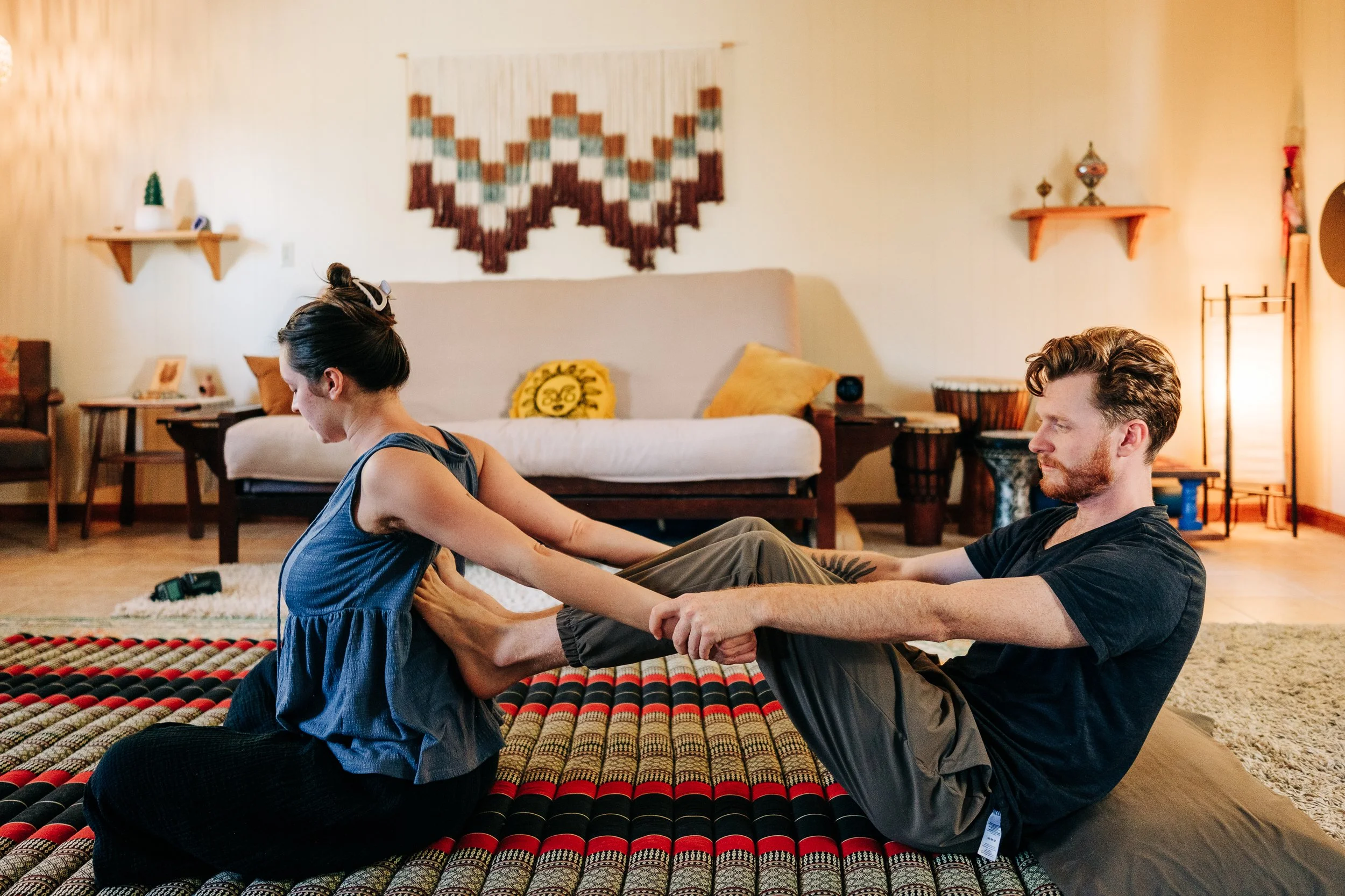 Inside the Zen Fox Healing Arts massage studio in West Asheville NC with Thai mat and warm decor