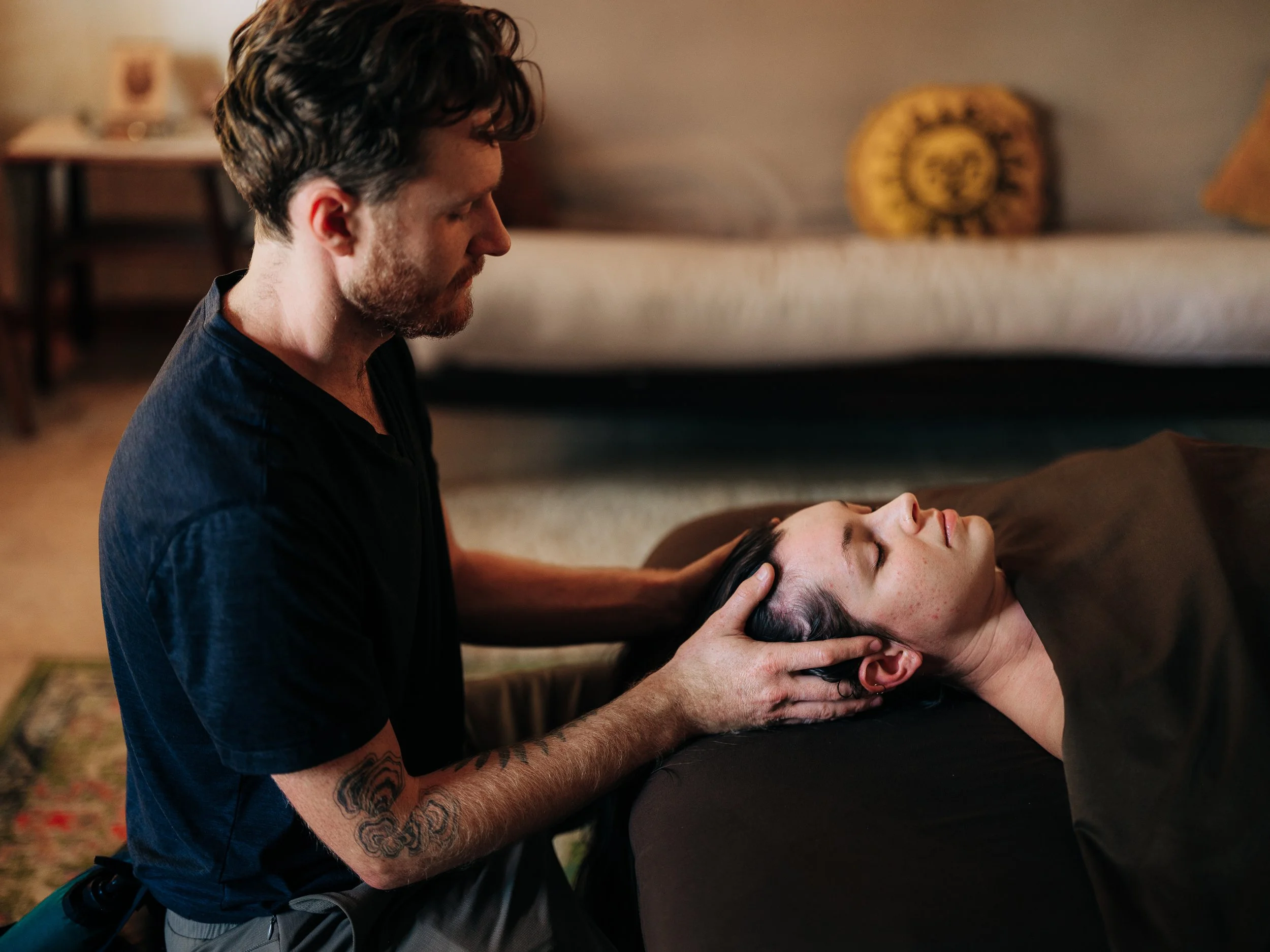 Gentle cranial hold during massage session